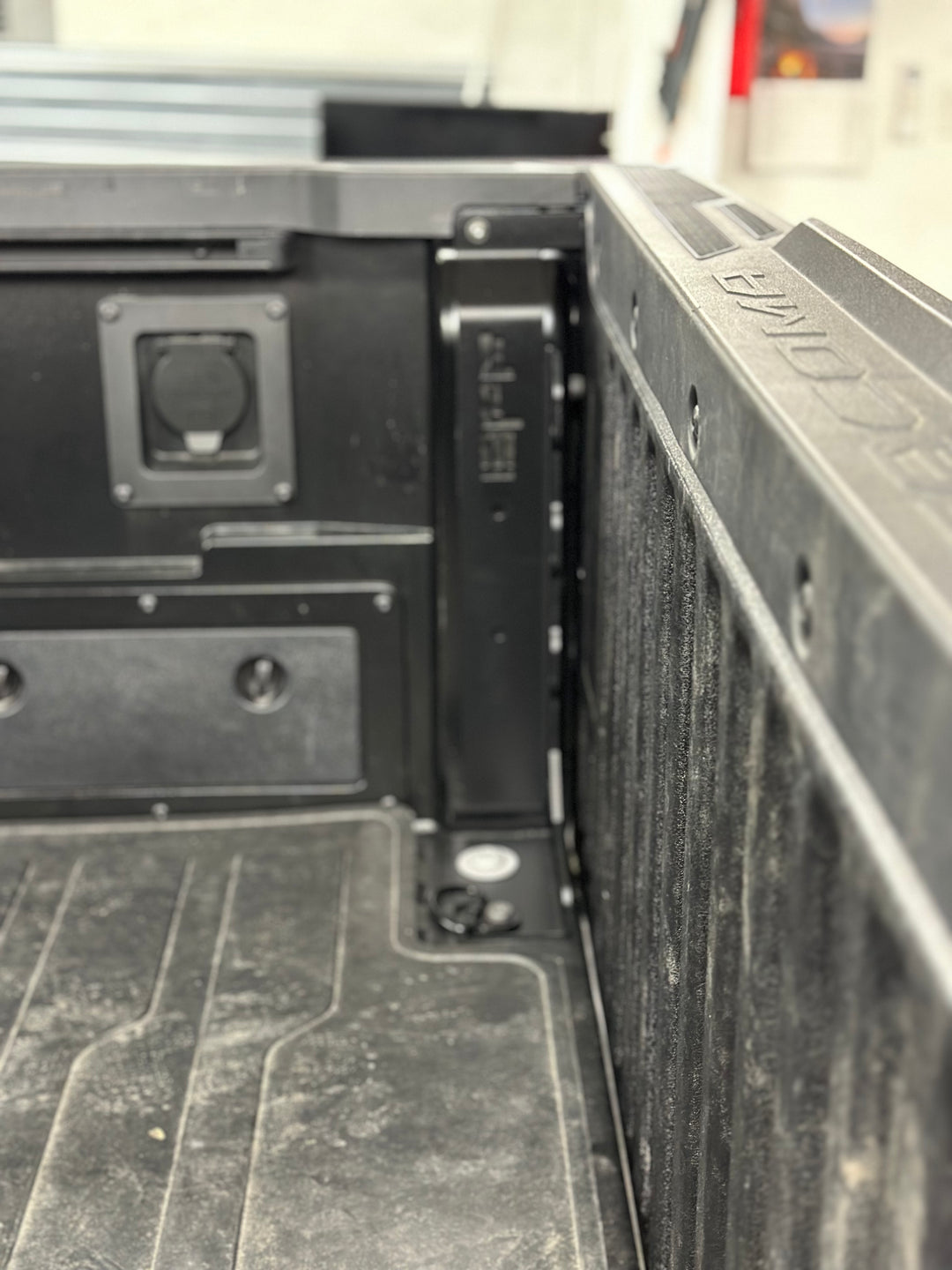 Close-up of a black metal BPF 2024-2025 Toyota Tacoma Bed Stiffeners installed inside a truck bed, showing durable construction and secure fitment for enhanced truck bed support.