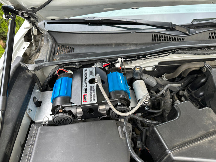 BPF 2016-2023 3rd Gen Tacoma Compressor mount installed under the hood featuring a durable CNC fabricated steel bracket securely holding a dual ARB air compressor system.