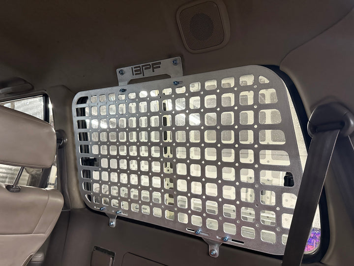 BPF 1990-1997 Toyota Land Cruiser Storage Panels installed inside vehicle featuring durable metal grid design for organized storage and secure fitment.