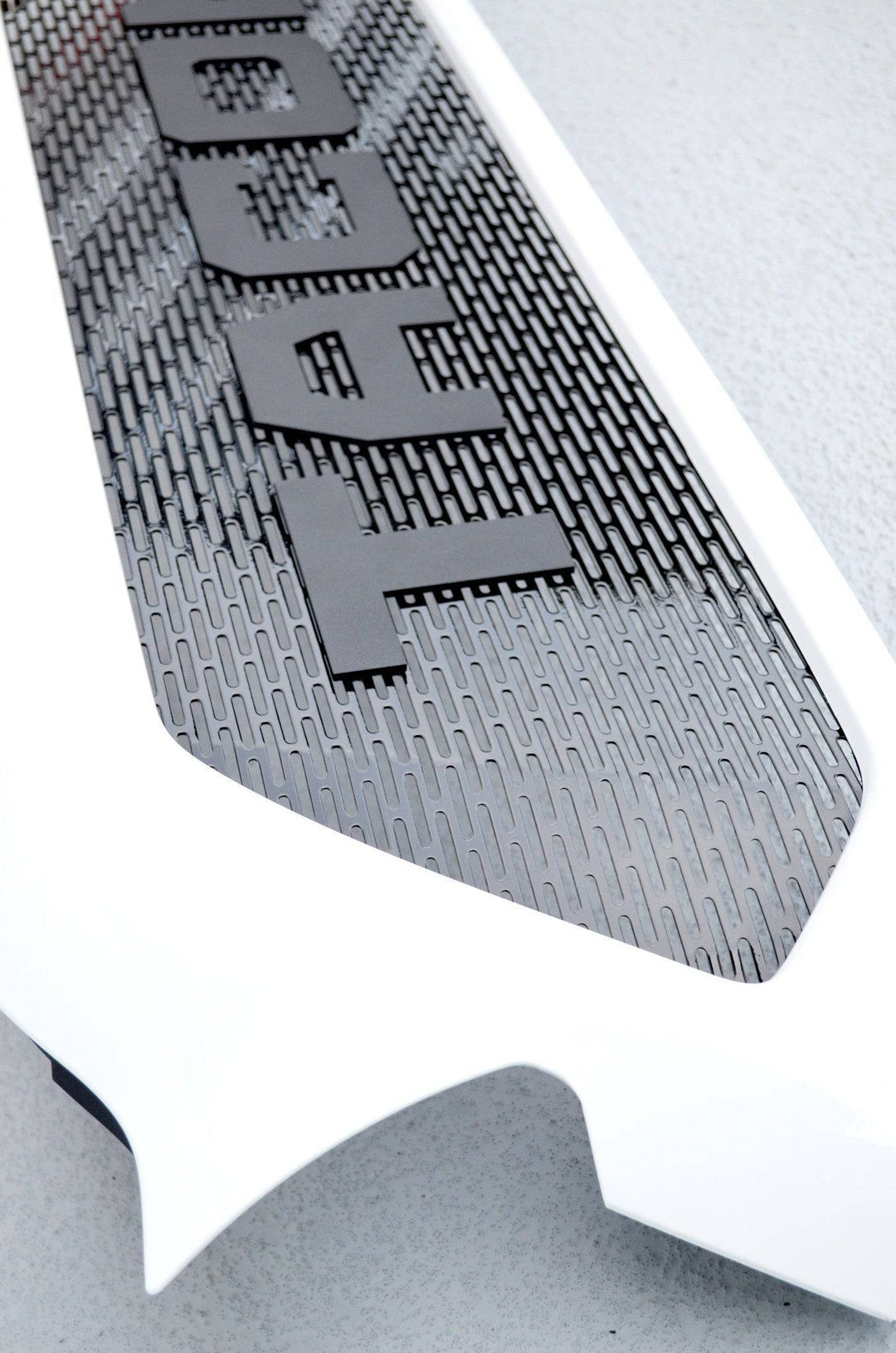 Close-up of a black mesh pattern with bold lettering on the BPF Completed 2012-2015 Toyota Tacoma Grill showing its textured, rugged design and durable finish.