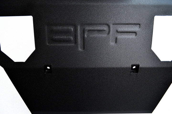 Close-up view of a powder-coated, CNC fabricated steel BPF 2005-2015 Toyota Tacoma Skid Plate with embossed BPF logo designed for heavy-duty off-road protection.