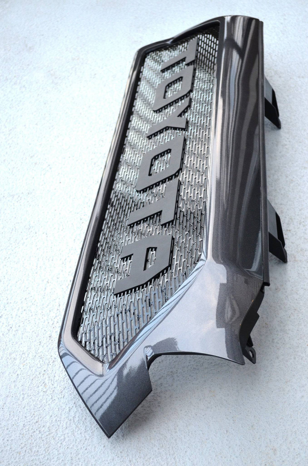 BPF Completed 2012-2015 Toyota Tacoma Grill with a sleek dark finish and bold mesh pattern, designed for OEM fitment and enhanced vehicle front-end style.