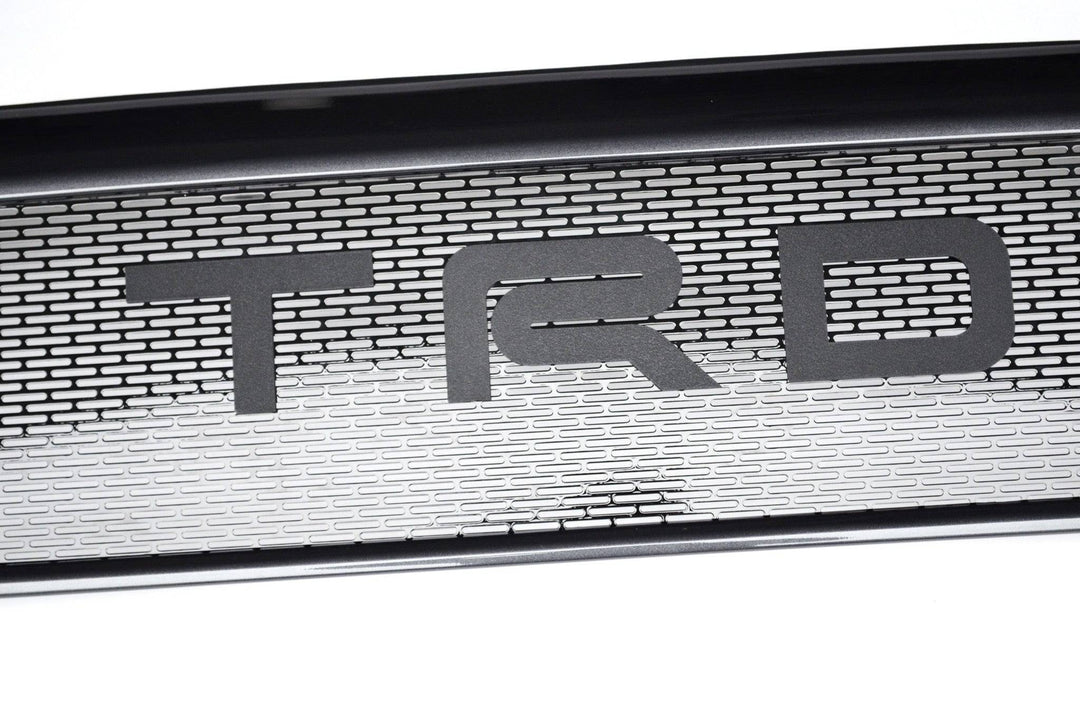 BPF Completed 2012-2015 Toyota Tacoma Grill featuring a durable powder-coated mesh design with bold TRD lettering, offering a CNC fabricated, OEM fitment upgrade for Tacoma trucks.