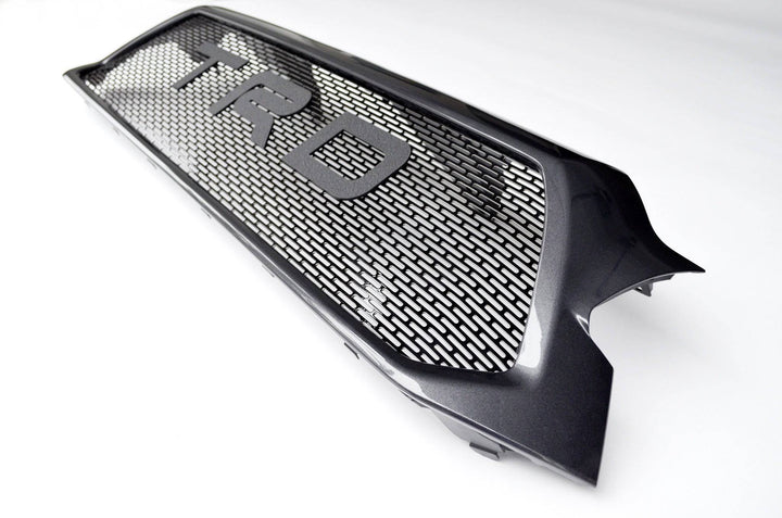 BPF Completed 2012-2015 Toyota Tacoma Grill featuring a black mesh design with bold TRD lettering, CNC fabricated for OEM fitment and durable, powder-coated finish.