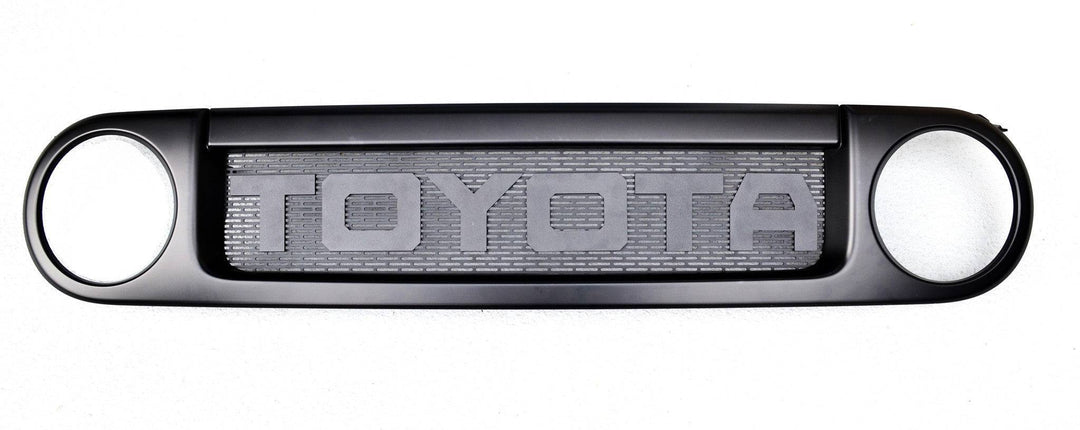 BPF Completed 2007-2014 FJ Cruiser Grill featuring a black powder-coated finish with bold TOYOTA lettering and a durable mesh center designed for OEM fitment and off-road style.
