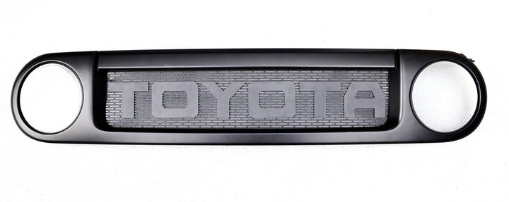 BPF Completed 2007-2014 FJ Cruiser Grill featuring a black powder-coated finish with bold TOYOTA lettering and a durable mesh center designed for OEM fitment and off-road style.