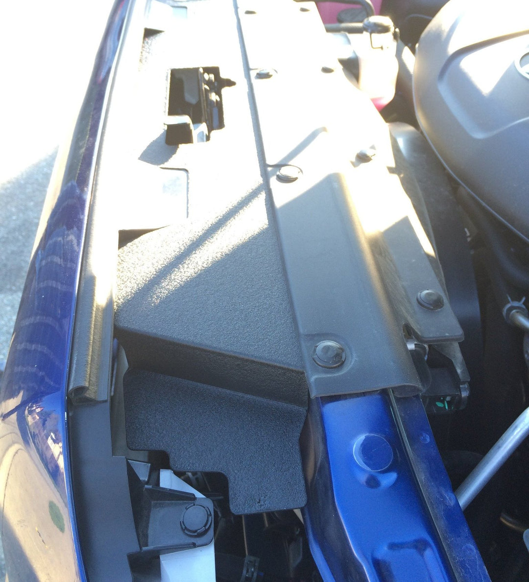 BPF 12-15 Toyota Tacoma Cooling Panel installed under the hood showing a textured black finish designed for OEM fitment and enhanced engine cooling.