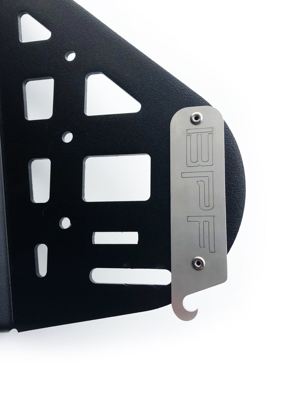 Close-up of a black textured panel with cutouts and a silver metal plate engraved with BPF, part of the BPF 2010-2024 4Runner Storage Panels designed for durable, CNC-fabricated 4Runner accessories.