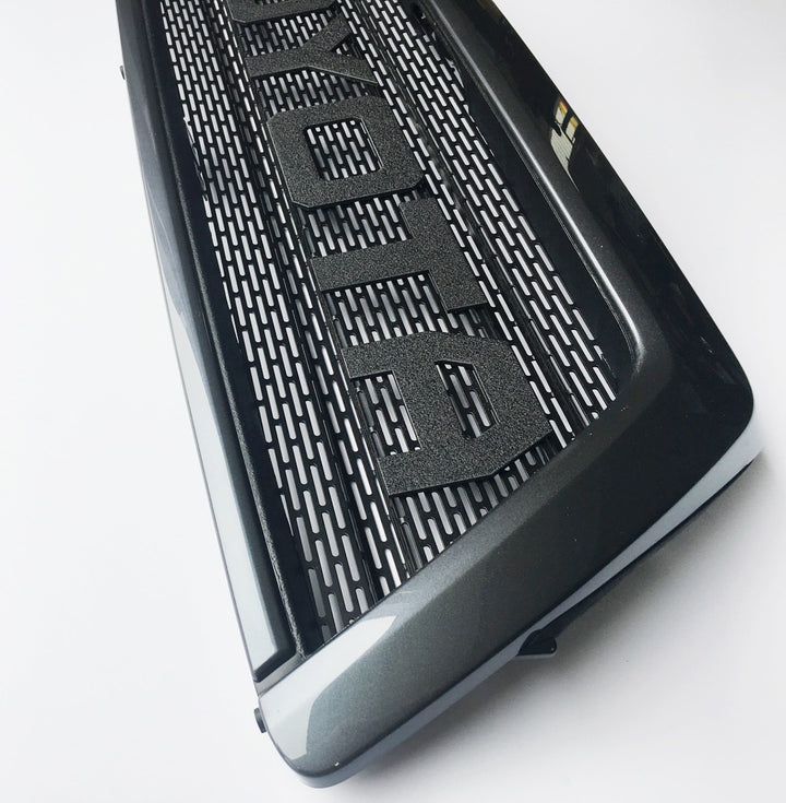 BPF 03-09 Toyota 4runner Grill in black with bold lettering and durable mesh design, CNC fabricated for a custom fit and enhanced front-end appearance.