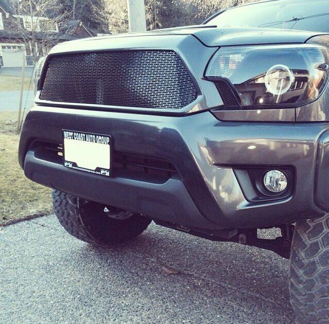 BPF Completed 2012-2015 Toyota Tacoma Grill installed on a gray truck, featuring a black powder-coated grill mesh with a sleek and durable design for off-road and everyday use.
