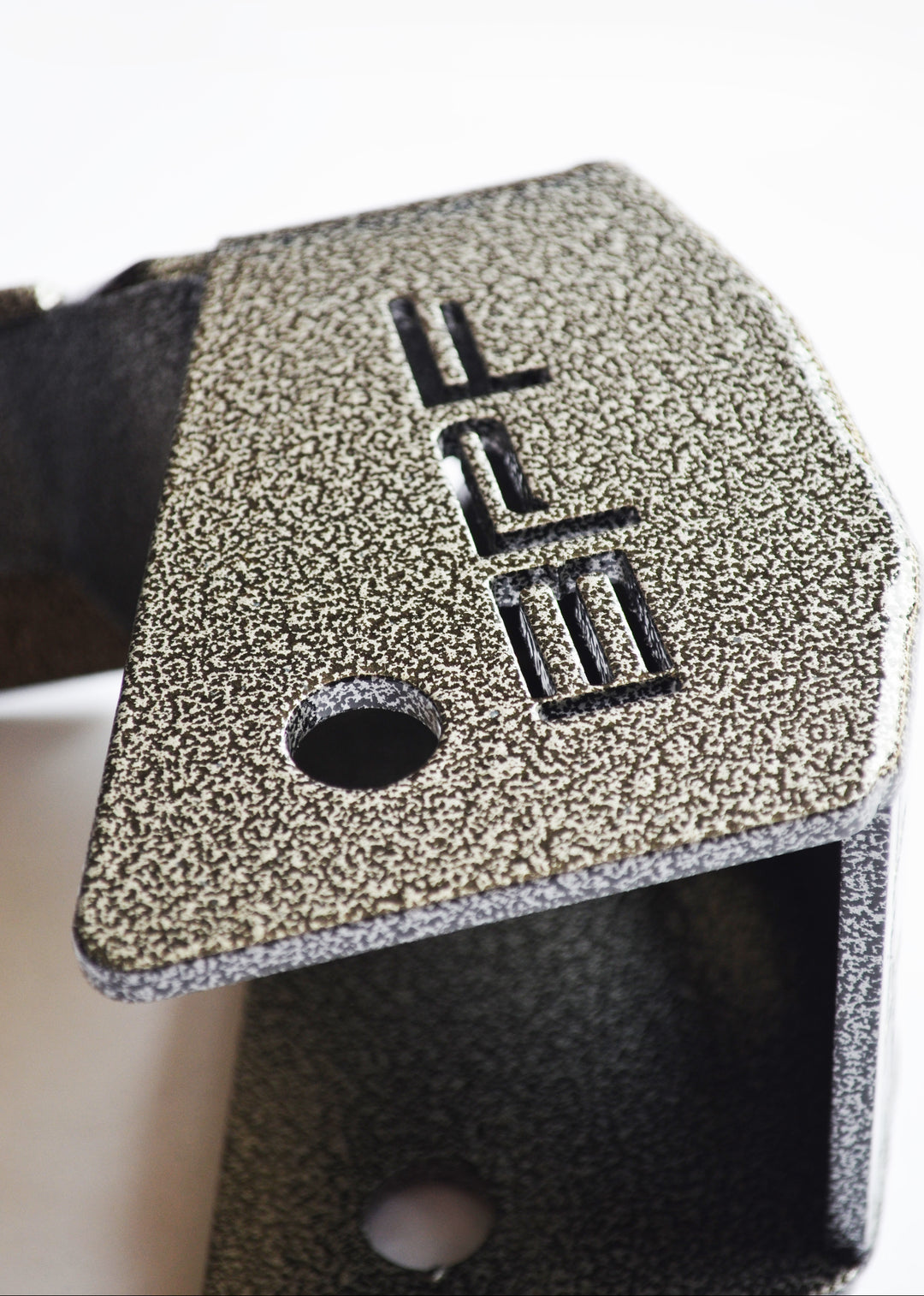 Close-up of textured powder-coated metal detail with embossed BPF logo on BPF 4runner 04-24/FJ 07-14 Shock Guards showing durable CNC fabricated finish.
